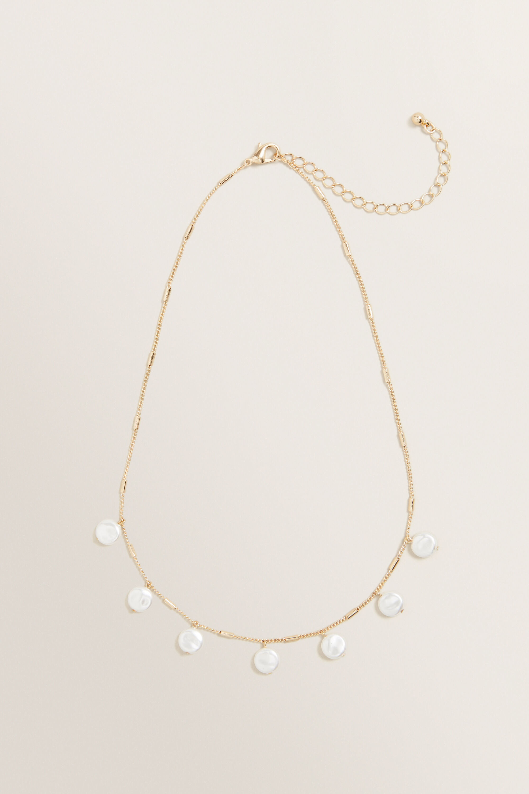 Seed pearl pendant deals