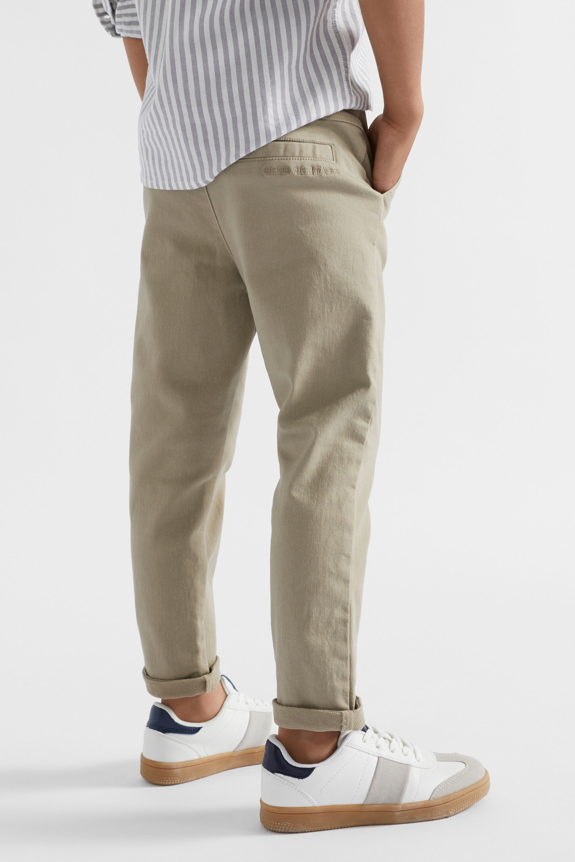 Model Wearing Brown Cargo Pants Or Cargo Trousers With White Sneakers  High-Res Stock Photo - Getty Images